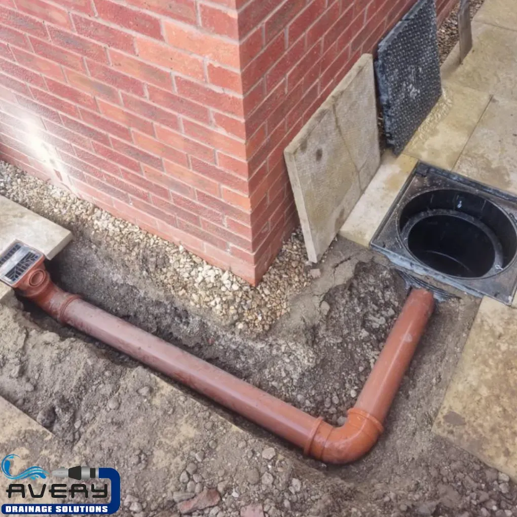 Newly installed drainage pipes and surface water drains during groundworks project
